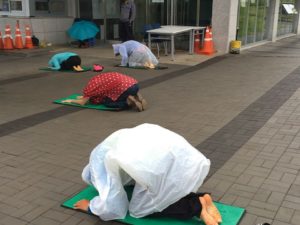 Gangjeong Village activists bowing as part of a daily morning ritual. (Photo by Ann Wright)